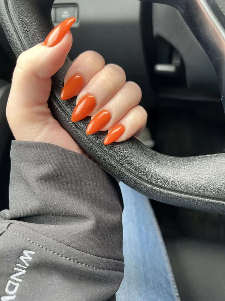 Burnt-orange almond-shaped gel manicure by Sokha&rsquo;s Nails & Spa